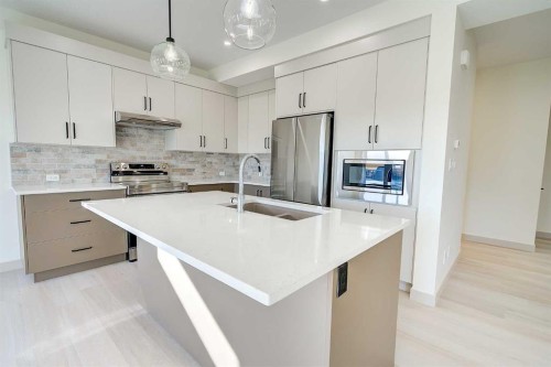 6 Ian Way, Sylvan Lake, AB - Indoor Photo Showing Kitchen With Stainless Steel Kitchen With Double Sink With Upgraded Kitchen