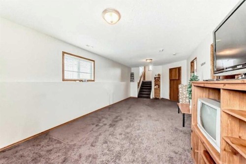 10 Kerr Close, Red Deer, AB - Indoor Photo Showing Other Room With Fireplace