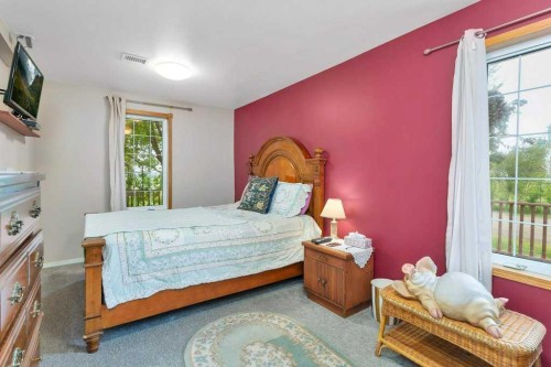 36009 Highway 2A South, Rural Red Deer County, AB - Indoor Photo Showing Bedroom