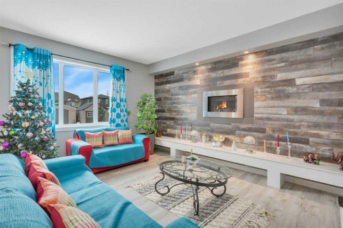 10 Mitchell Crescent, Blackfalds, AB - Indoor Photo Showing Living Room With Fireplace