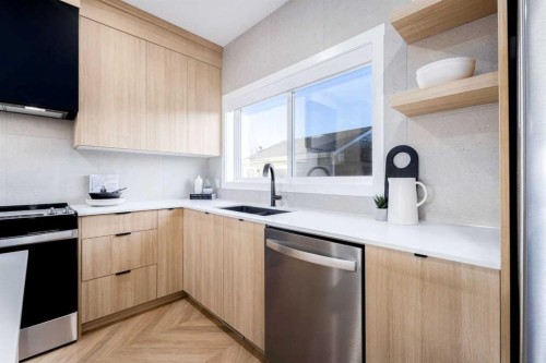 248 Verbena Common Sw, Calgary, AB - Indoor Photo Showing Kitchen With Double Sink With Upgraded Kitchen