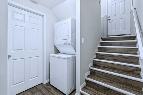 174 Brightonstone Landing Se, Calgary, AB - Indoor Photo Showing Laundry Room