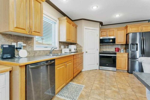 4912 46A Street, Clive, AB - Indoor Photo Showing Kitchen With Double Sink