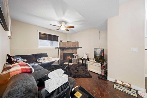 85 Turner Crescent, Red Deer, AB - Indoor Photo Showing Living Room With Fireplace