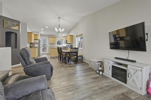 30 Fulmar Close, Sylvan Lake, AB - Indoor Photo Showing Living Room With Fireplace