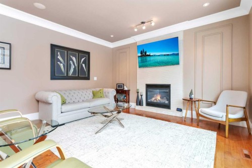 42 Grove Close, Red Deer, AB - Indoor Photo Showing Living Room With Fireplace