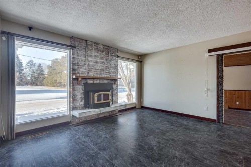 3 Armstrong Close, Red Deer, AB - Indoor Photo Showing Living Room With Fireplace