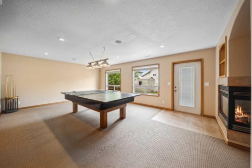 69 Alberts Close, Red Deer, AB - Indoor Photo Showing Other Room With Fireplace