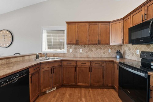 8 Van Dorp Street, Red Deer, AB - Indoor Photo Showing Kitchen With Double Sink