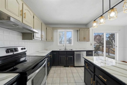 32 Huget Crescent, Red Deer, AB - Indoor Photo Showing Kitchen With Double Sink
