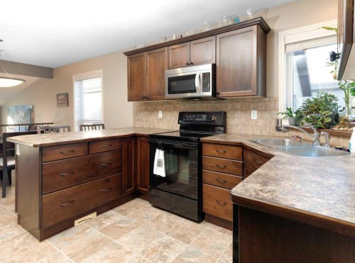 28 Vanson Close Se, Red Deer, AB - Indoor Photo Showing Kitchen With Double Sink