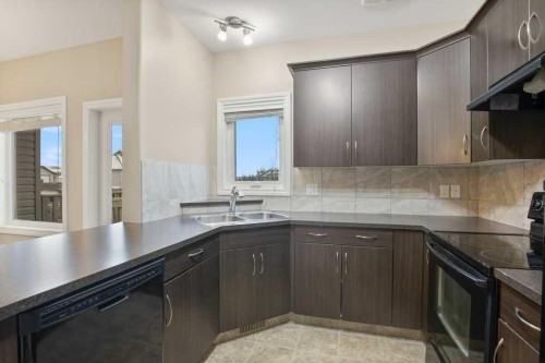 25 Ross Close, Sylvan Lake, AB - Indoor Photo Showing Kitchen With Double Sink