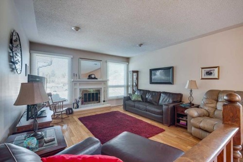40 Nielsen Close, Red Deer, AB - Indoor Photo Showing Living Room With Fireplace