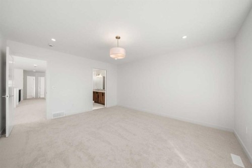 87 Heritage Manor, Cochrane, AB - Indoor Photo Showing Other Room