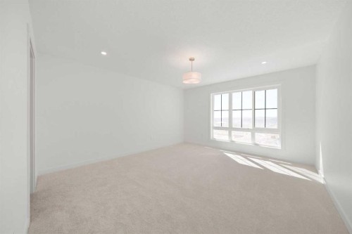 87 Heritage Manor, Cochrane, AB - Indoor Photo Showing Other Room