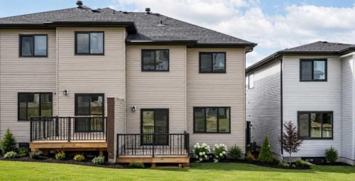 87 Heritage Manor, Cochrane, AB - Outdoor With Deck Patio Veranda With Exterior