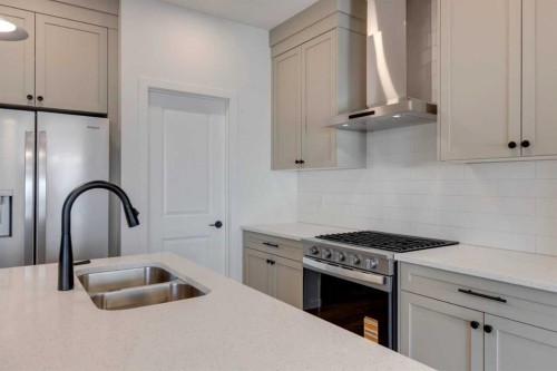 1379 Bayview Crescent Sw, Airdrie, AB - Indoor Photo Showing Kitchen With Double Sink With Upgraded Kitchen
