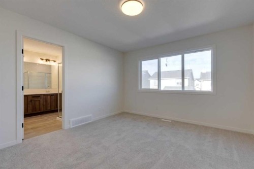 1379 Bayview Crescent Sw, Airdrie, AB - Indoor Photo Showing Other Room