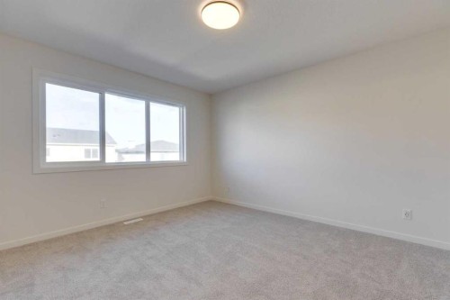 1379 Bayview Crescent Sw, Airdrie, AB - Indoor Photo Showing Other Room