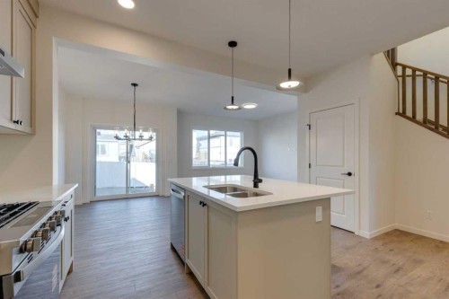1379 Bayview Crescent Sw, Airdrie, AB - Indoor Photo Showing Kitchen With Double Sink With Upgraded Kitchen