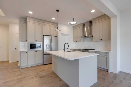 1379 Bayview Crescent Sw, Airdrie, AB - Indoor Photo Showing Kitchen With Upgraded Kitchen