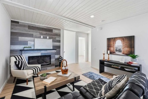 6 Metcalf Way, Lacombe, AB - Indoor Photo Showing Living Room With Fireplace