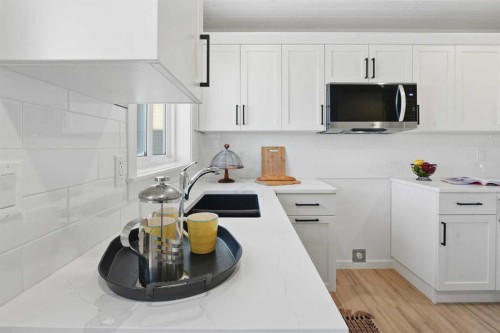 6 Metcalf Way, Lacombe, AB - Indoor Photo Showing Kitchen With Double Sink