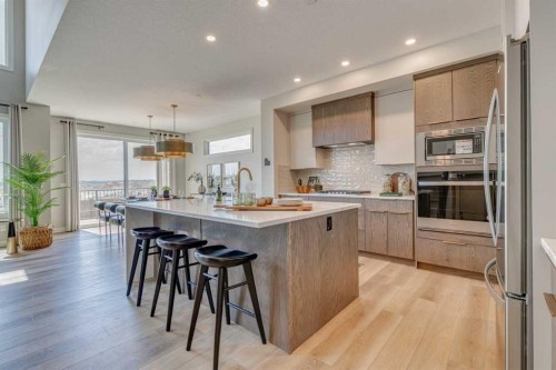 55 Bridgeport Circle, Chestermere, AB - Indoor Photo Showing Kitchen With Stainless Steel Kitchen With Upgraded Kitchen