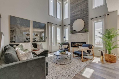 55 Bridgeport Circle, Chestermere, AB - Indoor Photo Showing Living Room With Fireplace