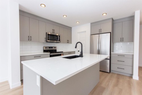 12 Trinity Street, Lacombe, AB - Indoor Photo Showing Kitchen With Stainless Steel Kitchen With Upgraded Kitchen