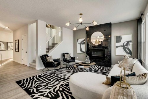 249 Dawson Wharf Crescent, Chestermere, AB - Indoor Photo Showing Other Room With Fireplace