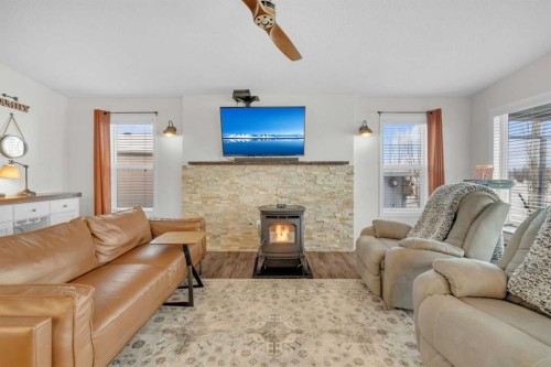 19-41019 Range Road 11, Rural Lacombe County, AB - Indoor Photo Showing Living Room With Fireplace
