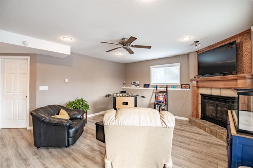 82 Westglen Boulevard, Blackfalds, AB - Indoor Photo Showing Living Room With Fireplace