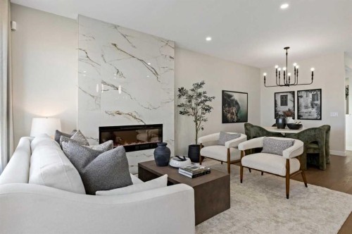 116 Huxland Close Ne, Calgary, AB - Indoor Photo Showing Living Room With Fireplace
