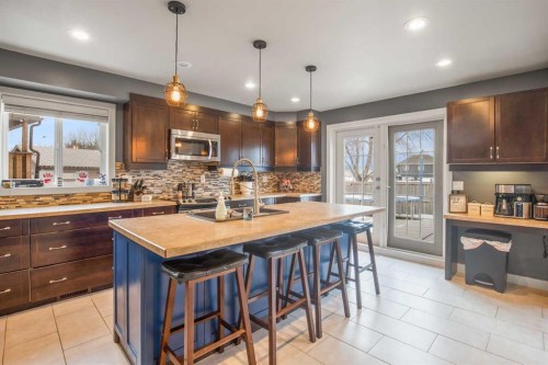 13 Blackstone Avenue, Lacombe, AB - Indoor Photo Showing Kitchen With Upgraded Kitchen