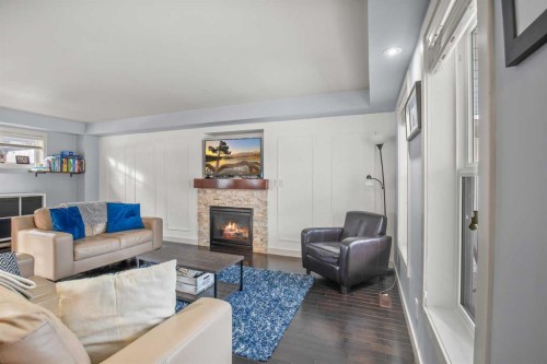 13 Blackstone Avenue, Lacombe, AB - Indoor Photo Showing Living Room With Fireplace