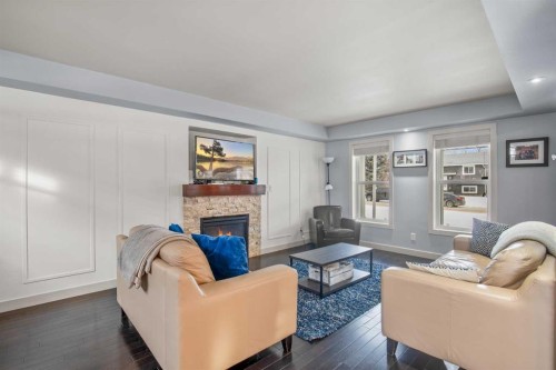 13 Blackstone Avenue, Lacombe, AB - Indoor Photo Showing Living Room With Fireplace
