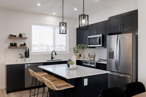 209-81 Midtown Boulevard Sw, Airdrie, AB - Indoor Photo Showing Kitchen With Upgraded Kitchen