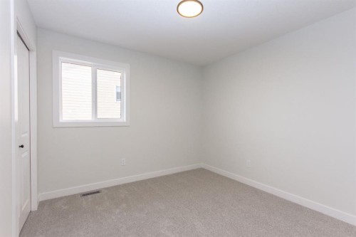 208 Augustus Way, Penhold, AB - Indoor Photo Showing Other Room