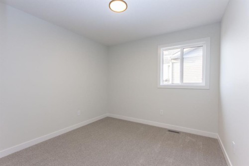 208 Augustus Way, Penhold, AB - Indoor Photo Showing Other Room