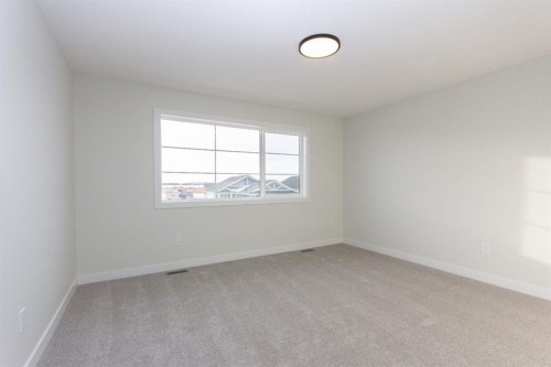 208 Augustus Way, Penhold, AB - Indoor Photo Showing Other Room