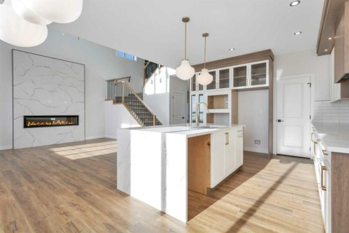 19 Everson Close, Red Deer, AB - Indoor Photo Showing Kitchen With Fireplace