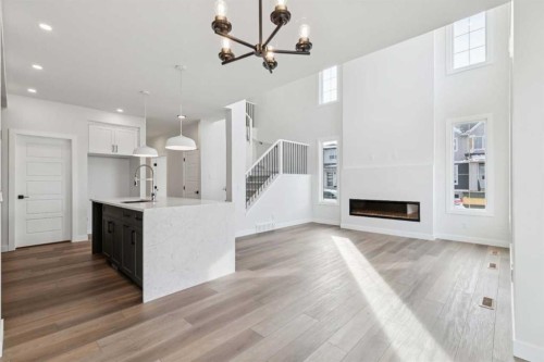 79 Versant Rise Sw, Calgary, AB - Indoor With Fireplace