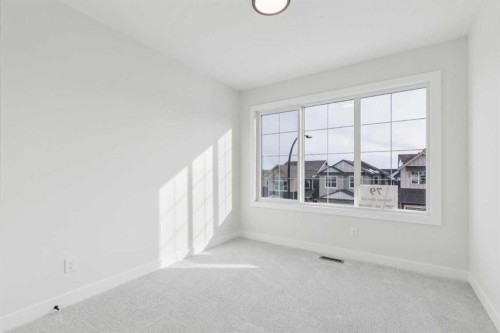 79 Versant Rise Sw, Calgary, AB - Indoor Photo Showing Other Room