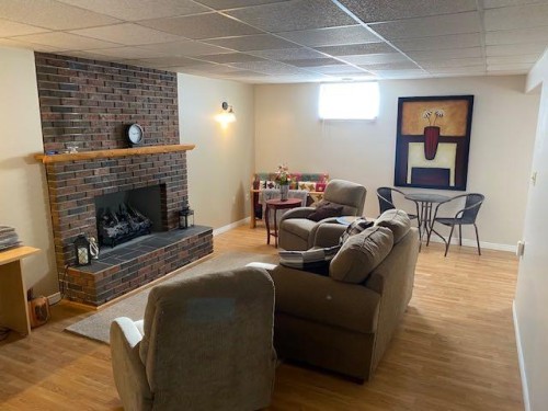 5809 43 Avenue, Camrose, AB - Indoor Photo Showing Basement With Fireplace
