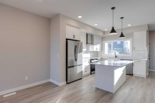 315 Fireside Drive, Cochrane, AB - Indoor Photo Showing Kitchen With Upgraded Kitchen