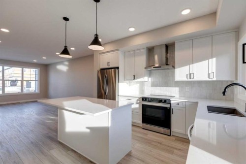 315 Fireside Drive, Cochrane, AB - Indoor Photo Showing Kitchen With Upgraded Kitchen