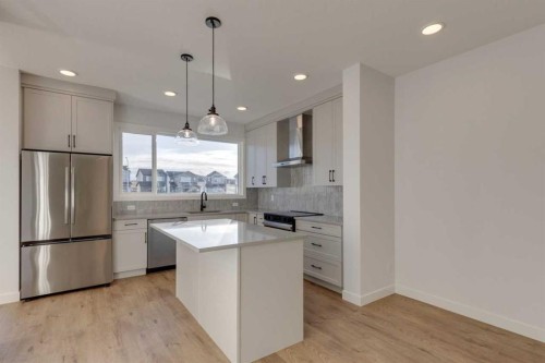 367 Fireside Drive, Cochrane, AB - Indoor Photo Showing Kitchen With Upgraded Kitchen