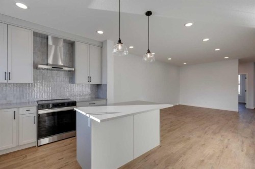 367 Fireside Drive, Cochrane, AB - Indoor Photo Showing Kitchen With Upgraded Kitchen