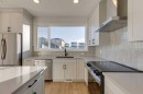 367 Fireside Drive, Cochrane, AB  - Indoor Photo Showing Kitchen With Upgraded Kitchen 